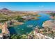 Aerial view of lakeside community featuring a water park, docks, and picturesque mountain scenery at 30 Strada Di Villaggio # 306, Henderson, NV 89011