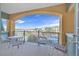 Beautiful balcony with wrought iron railing, comfortable seating, and scenic views of the lake and surrounding landscape at 30 Strada Di Villaggio # 306, Henderson, NV 89011