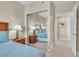 This bedroom has comfortable beds, mirrored closet doors and carpeted floor at 30 Strada Di Villaggio # 306, Henderson, NV 89011