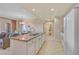 Open-concept kitchen with a granite island and an adjacent living and dining area at 30 Strada Di Villaggio # 306, Henderson, NV 89011