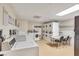 Clean community laundry room with multiple washers, dryers, folding tables and signage at 30 Strada Di Villaggio # 306, Henderson, NV 89011