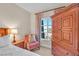 Cozy main bedroom featuring a comfortable bed, and wooden furniture with natural light at 30 Strada Di Villaggio # 306, Henderson, NV 89011