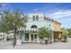 Unique two-story building with appealing architecture; features blue and yellow exterior and ample storefront windows at 30 Strada Di Villaggio # 306, Henderson, NV 89011
