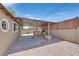 Backyard patio with a built in barbecue area and low maintenance desert landscaping at 3101 Greenbriar Dr, Las Vegas, NV 89121