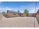 Large backyard featuring patio with built-in barbecue and desert landscaping at 3101 Greenbriar Dr, Las Vegas, NV 89121