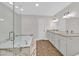 Elegant bathroom featuring a soaking tub, separate glass shower, and a double vanity with granite countertops at 3101 Greenbriar Dr, Las Vegas, NV 89121