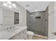 Modern bathroom with a sleek glass-enclosed shower, stylish vanity, and elegant tile accents at 3101 Greenbriar Dr, Las Vegas, NV 89121