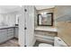 Modern bathroom with wood-look accents, floating vanity, and nearby laundry room at 3101 Greenbriar Dr, Las Vegas, NV 89121