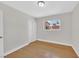 Bedroom features wood floors, neutral walls, and natural light from a window at 3101 Greenbriar Dr, Las Vegas, NV 89121