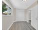 Bright room features fresh paint, wood-look laminate flooring, closet, and an entrance to an adjacent room at 3101 Greenbriar Dr, Las Vegas, NV 89121