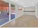 A bonus room includes tile flooring, sliding glass doors and a sink with white cabinets at 3101 Greenbriar Dr, Las Vegas, NV 89121