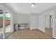 Bonus room with laminate flooring, desk, and a glass sliding door to the backyard at 3101 Greenbriar Dr, Las Vegas, NV 89121