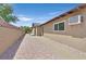 Exterior side view of home with low-maintenance landscaping, and concrete path at 3101 Greenbriar Dr, Las Vegas, NV 89121