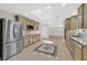 Modern kitchen with stainless steel appliances, a skylight, and ample counter space at 3101 Greenbriar Dr, Las Vegas, NV 89121
