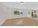 Bright living room with wood floors, recessed lighting, a view of the backyard and access to the kitchen at 3101 Greenbriar Dr, Las Vegas, NV 89121