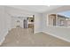 Open living room area showcasing the kitchen with stainless steel appliances and ample natural light at 3101 Greenbriar Dr, Las Vegas, NV 89121