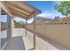 Covered patio and backyard featuring concrete and desert landscaping at 3101 Greenbriar Dr, Las Vegas, NV 89121