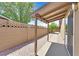 Home featuring a covered patio, concrete and desert landscaping and block wall fencing at 3101 Greenbriar Dr, Las Vegas, NV 89121