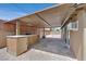 Covered patio features a built-in grill, bar with granite countertops, and recessed lighting at 3101 Greenbriar Dr, Las Vegas, NV 89121