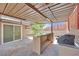 A covered patio includes a bar with granite countertops, and a BBQ at 3101 Greenbriar Dr, Las Vegas, NV 89121