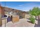 A covered patio features tile flooring, a bar with granite countertop, and a BBQ at 3101 Greenbriar Dr, Las Vegas, NV 89121