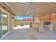 Covered patio complete with granite countertop and built-in BBQ at 3101 Greenbriar Dr, Las Vegas, NV 89121