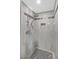 Tiled shower with a rainfall shower head and a built-in niche at 3101 Greenbriar Dr, Las Vegas, NV 89121