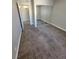 Carpeted bedroom featuring mirrored sliding closet doors and neutral paint at 3151 Soaring Gulls Dr # 2101, Las Vegas, NV 89128