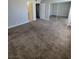 Carpeted bedroom featuring mirrored closet doors and neutral paint throughout at 3151 Soaring Gulls Dr # 2101, Las Vegas, NV 89128