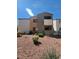 A well-kept exterior view of the condo with desert landscaping on a sunny day at 3151 Soaring Gulls Dr # 2101, Las Vegas, NV 89128