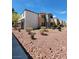 Exterior shot of the condo building featuring manicured desert landscaping at 3151 Soaring Gulls Dr # 2101, Las Vegas, NV 89128