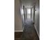 Hallway in condo with carpet and access to other rooms with natural light at 3151 Soaring Gulls Dr # 2101, Las Vegas, NV 89128