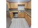 Well-equipped kitchen featuring matching appliances, granite countertops, and light maple cabinetry offers a cohesive look at 3151 Soaring Gulls Dr # 2101, Las Vegas, NV 89128