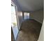 Condo living room with carpeted floor and access to an outdoor space at 3151 Soaring Gulls Dr # 2101, Las Vegas, NV 89128