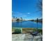 Waterfront view from the property with palm trees and lush plants at 3151 Soaring Gulls Dr # 2101, Las Vegas, NV 89128