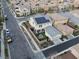 This aerial view showcases a home with solar panels, a private courtyard, and a detached two-car garage at 3237 Mist Effect Ave, Henderson, NV 89044