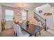 Well-lit dining area featuring a modern chandelier and staircase access at 3237 Mist Effect Ave, Henderson, NV 89044