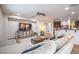 Bright living room with a ceiling fan, TV, and comfortable seating area at 3237 Mist Effect Ave, Henderson, NV 89044