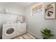 Convenient laundry room equipped with a washer, dryer, storage shelves, and ample counter space at 343 W Basic Rd, Henderson, NV 89015