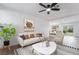 Inviting living room with a comfortable sofa, stylish decor, and an open view to the dining area at 343 W Basic Rd, Henderson, NV 89015
