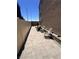 Comfortable backyard with stone pavers, lounge chairs, and a well-kept fence for privacy at 369 Stone Fly Rd, North Las Vegas, NV 89032
