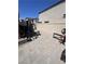 Private backyard with pavers, exercise equipment, and secure fencing; ideal for outdoor workouts at 369 Stone Fly Rd, North Las Vegas, NV 89032