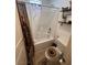 Full bathroom with a bathtub and shower combination, toilet, and shelving for storage at 369 Stone Fly Rd, North Las Vegas, NV 89032