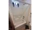Bright bathroom featuring a bathtub and shower combination with clean, white tile surround at 369 Stone Fly Rd, North Las Vegas, NV 89032
