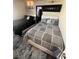 Bedroom featuring two beds with contemporary decor, stylish linens, and modern lighting at 369 Stone Fly Rd, North Las Vegas, NV 89032