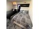 Cozy bedroom with two beds, modern decor, stylish linens and unique wall art at 369 Stone Fly Rd, North Las Vegas, NV 89032