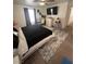 Inviting bedroom with desk, TV, and area rug, styled for comfort and productivity at 369 Stone Fly Rd, North Las Vegas, NV 89032