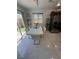 Bright dining area with sliding door and backyard views, adjacent to a modern kitchen at 369 Stone Fly Rd, North Las Vegas, NV 89032
