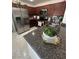Well-equipped kitchen featuring stainless steel appliances, granite countertops, and marble floors at 369 Stone Fly Rd, North Las Vegas, NV 89032