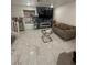 Cozy living room with fireplace and marble flooring throughout the lower level at 369 Stone Fly Rd, North Las Vegas, NV 89032